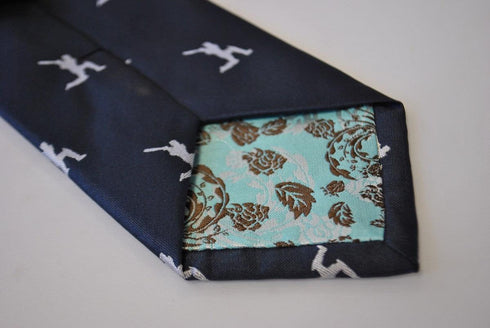 navy tie with white cricket player silhouette design